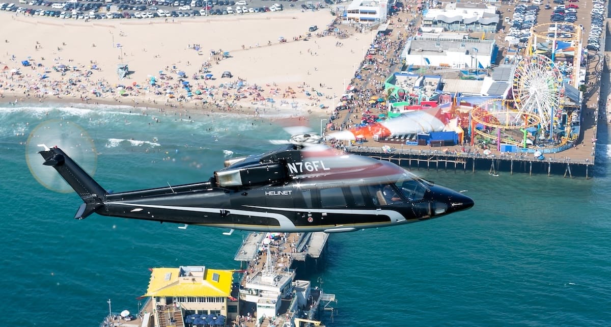 Helicopter flying over a beach